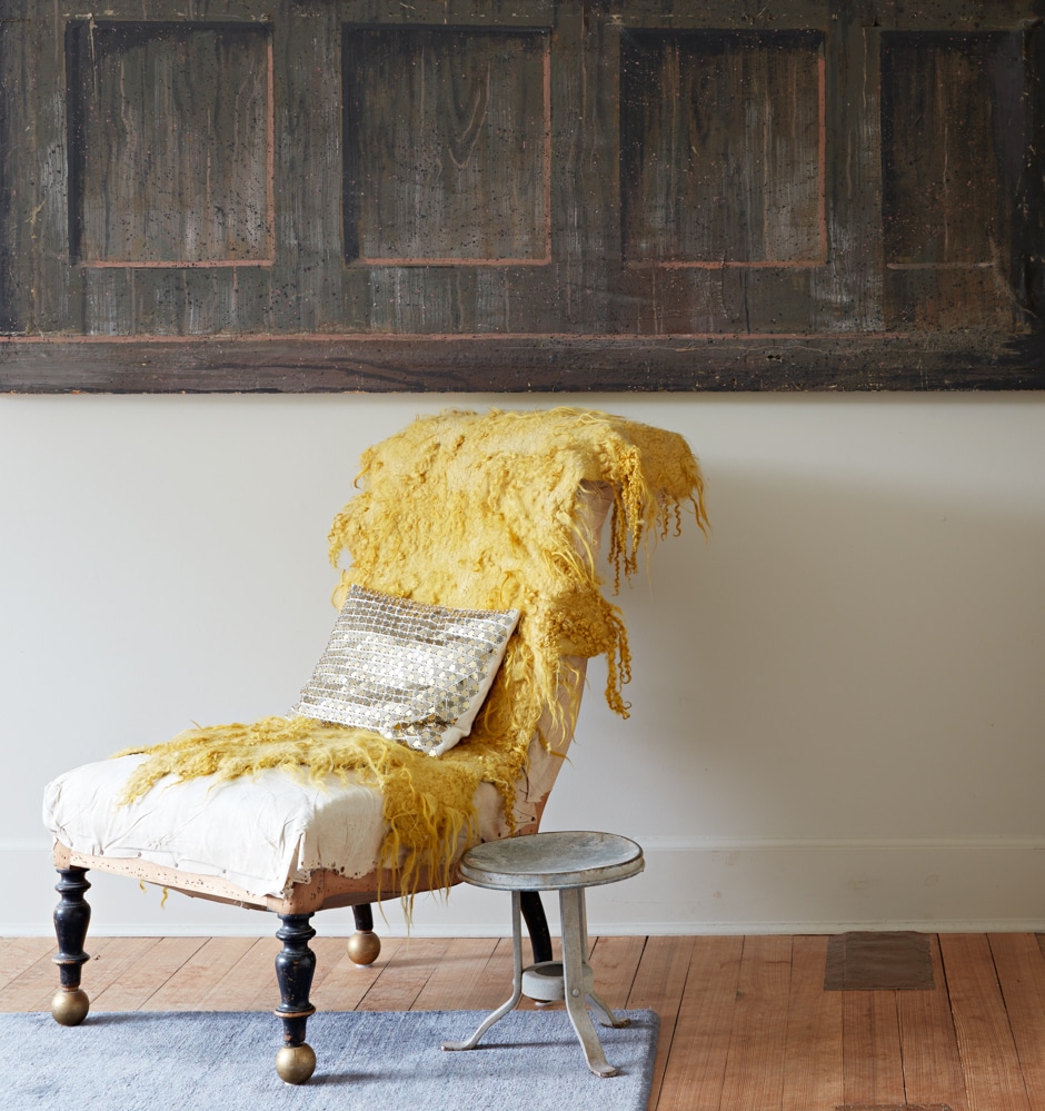 antique slipper chair in bedroom