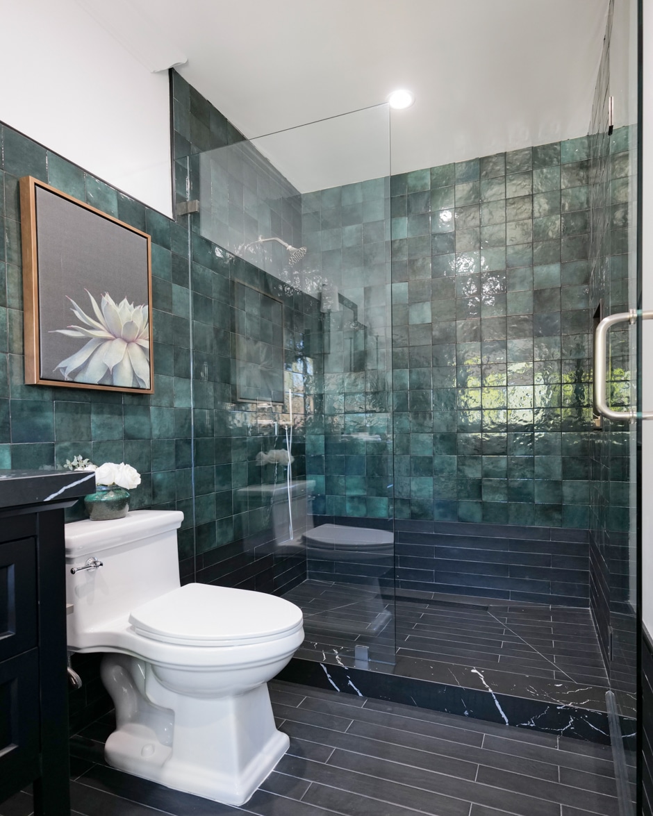 bathroom with blue-green tiled walls
