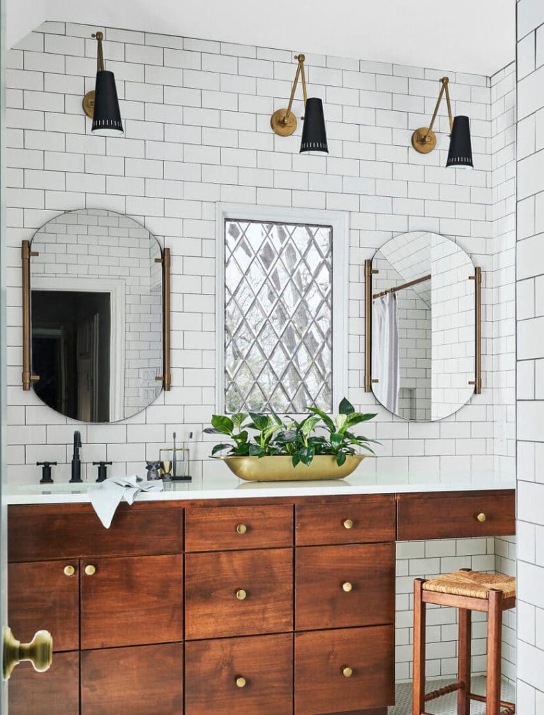 white tiled bathroom with metal fixtures