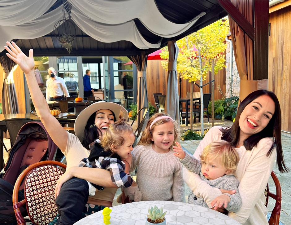 brie and nikki bella with kids at table