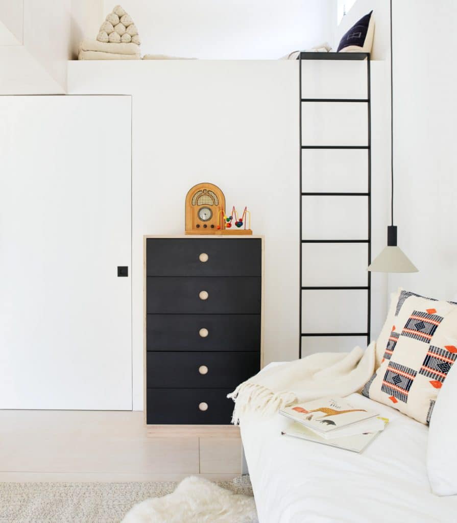 black and white loft with ladder