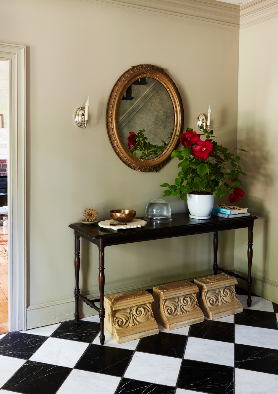 entryway with black and white marble tiles