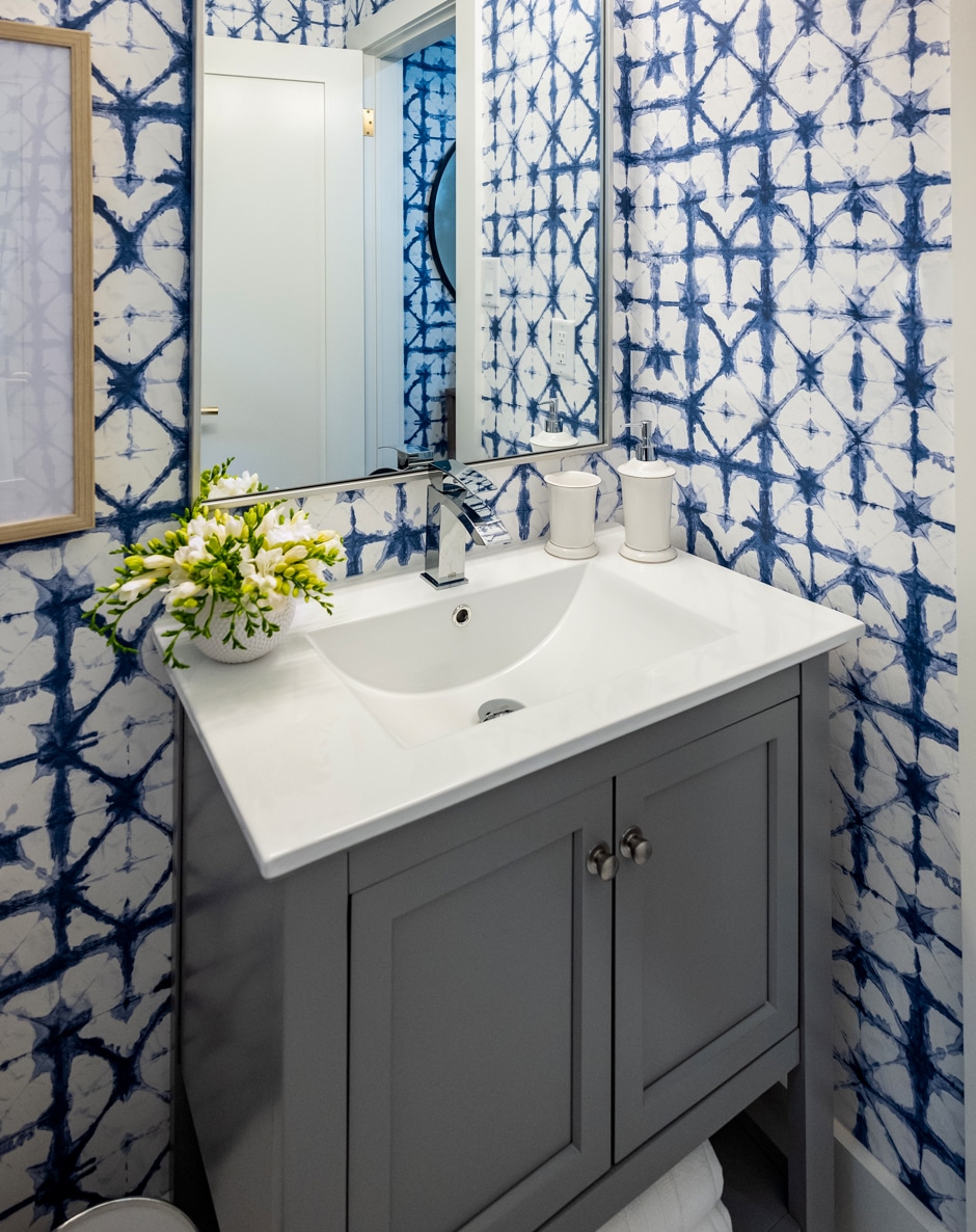 blue and white wallpapered bathroom