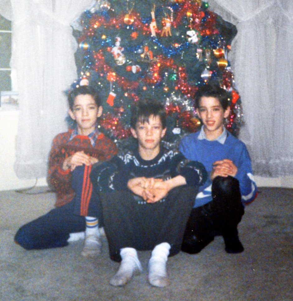 twins and JD in front of christmas tree
