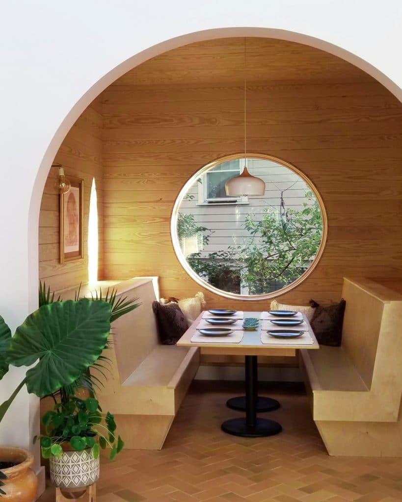 arched entry to breakfast nook with circular window