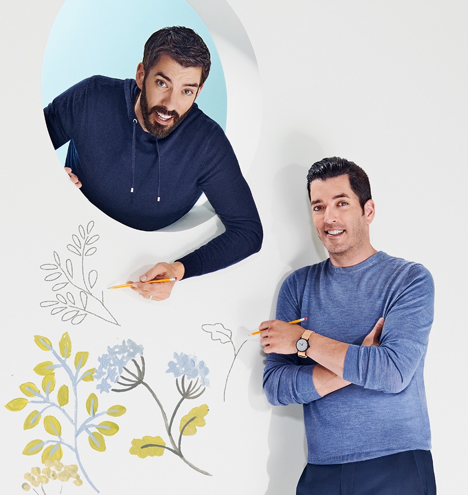brothers posing with flower illustration on white wall