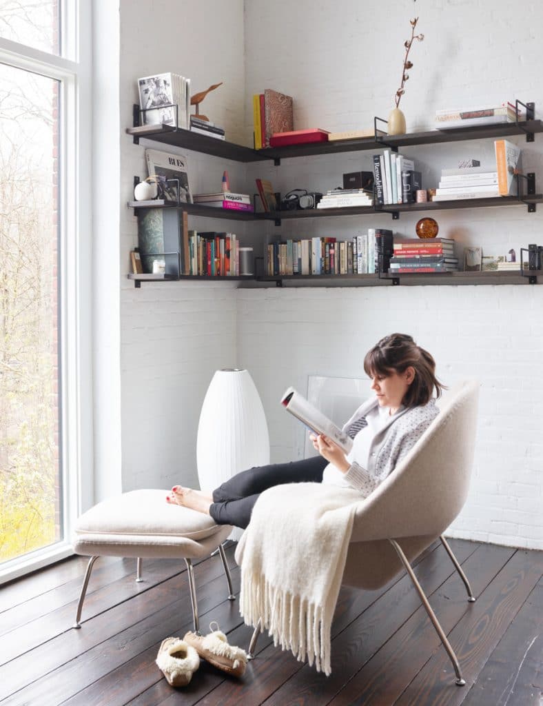 claire reading in lounge area