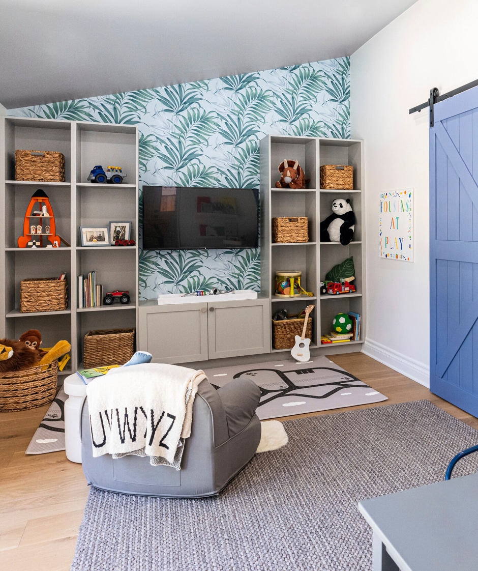colorful kids space with wall shelves and TV