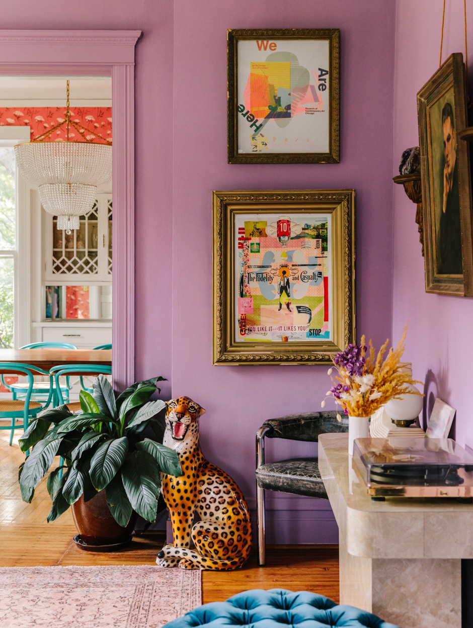 lavender dining room corner with colorful art and plants