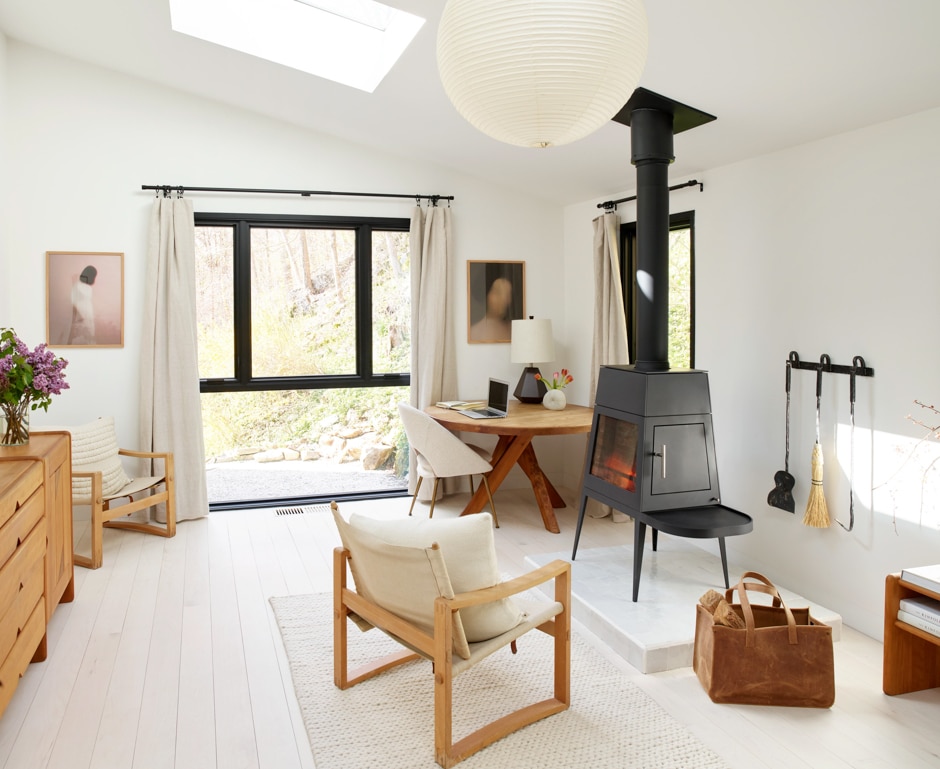 cosy beige room with wood burning stove