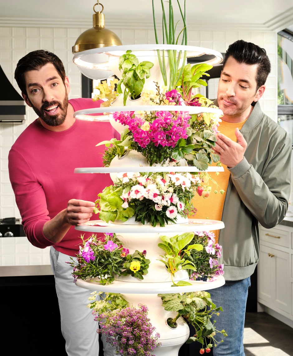 Drew and Jonathan with plants on stand