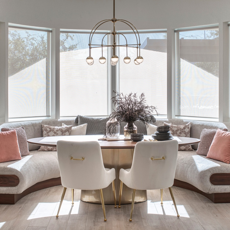 elegant white breakfast nook with modern light fixture