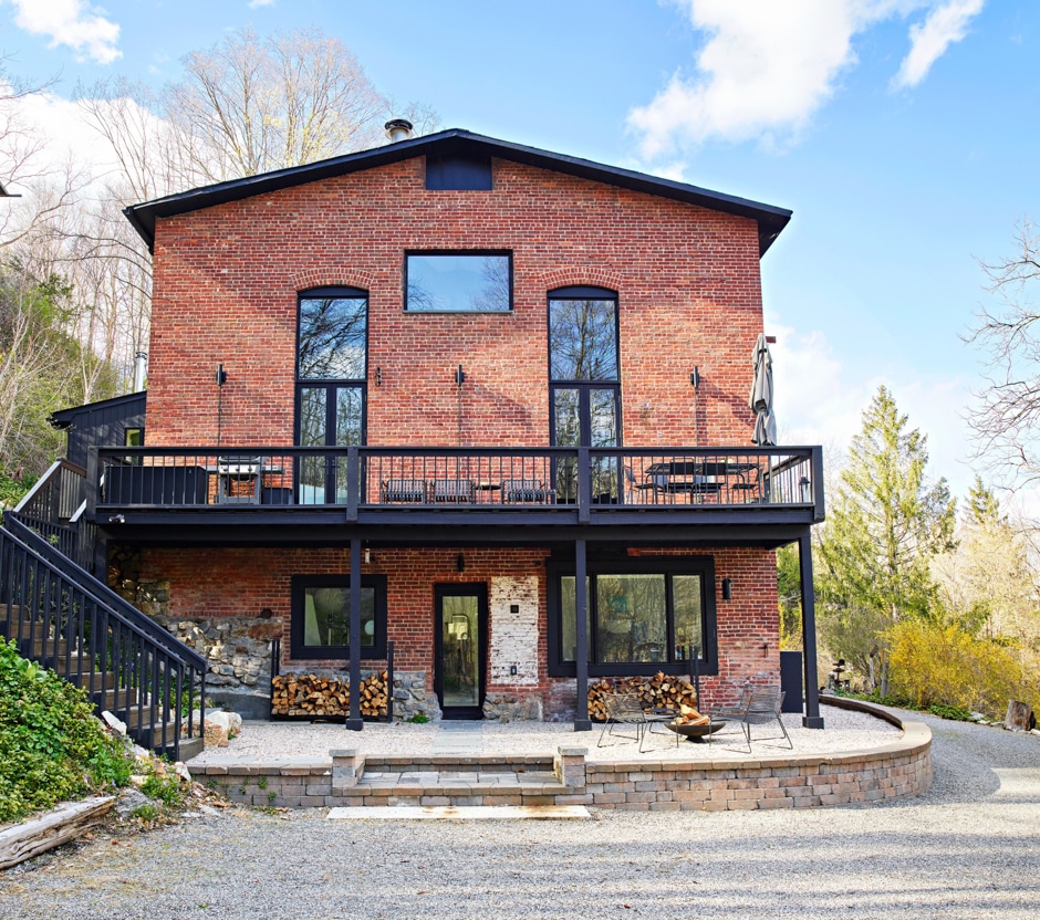 exterior shot of brick house with black trim