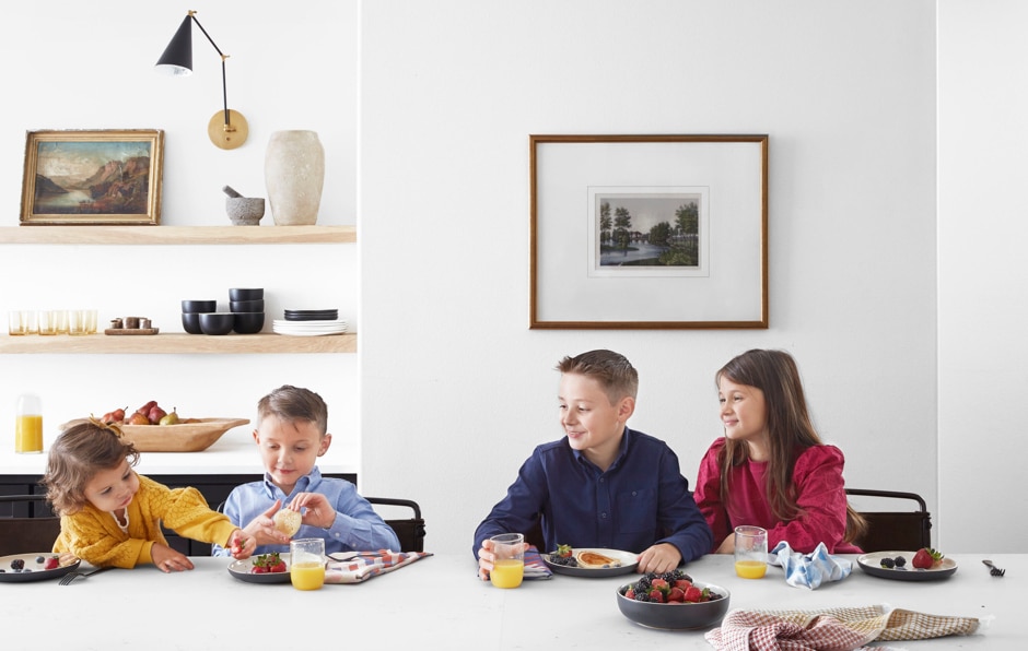 kids sitting at breakfast table together