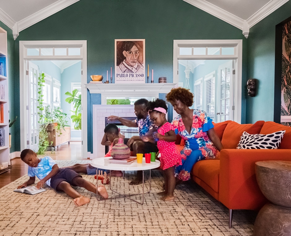 family lounging in colorful vaulted ceiling living room