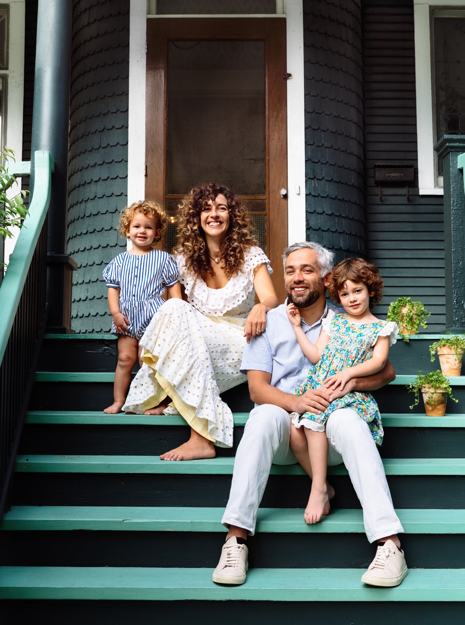 family portrait on green steps of chicago home