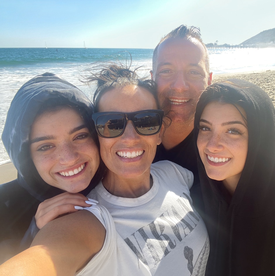 a family selfie on the beach
