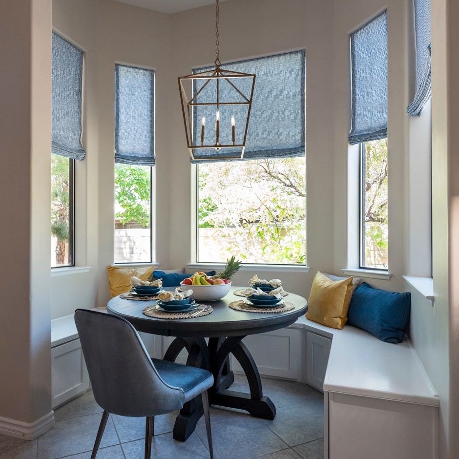 breakfast nook with geometric lighting fixture