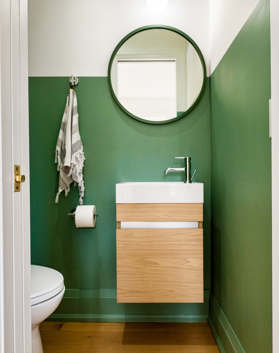 green block color bathroom with mounted sink