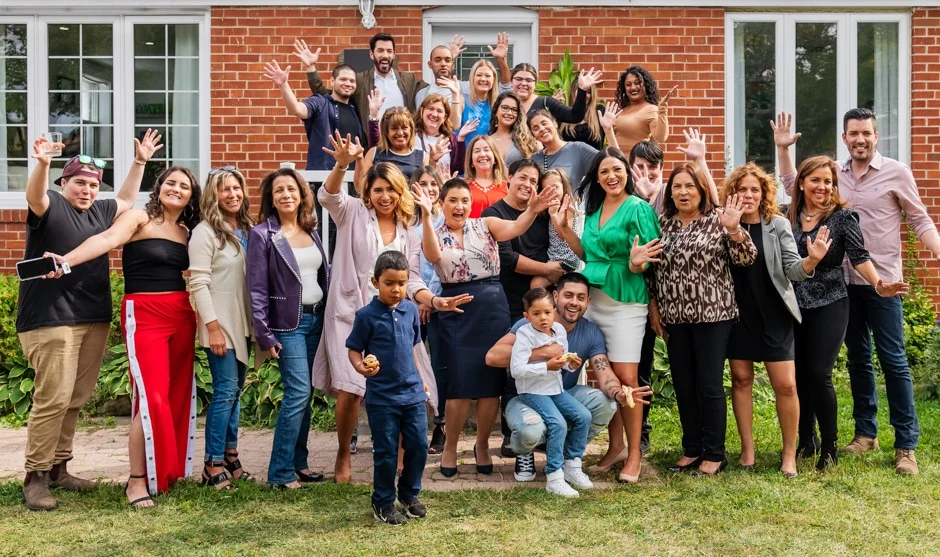 big group celebrating home renovation