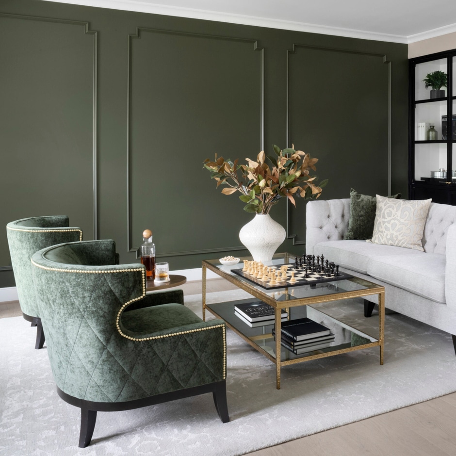 dark green sitting room with trim