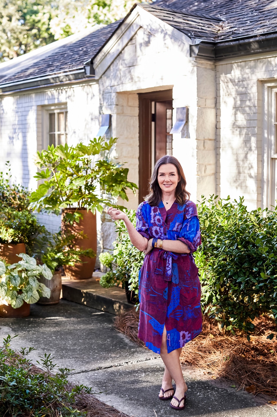 Jayme portrait with home exterior