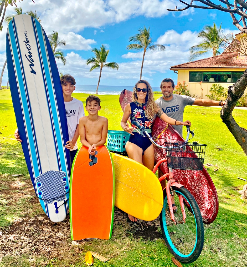 Kat and family portrait with surf boards and bike