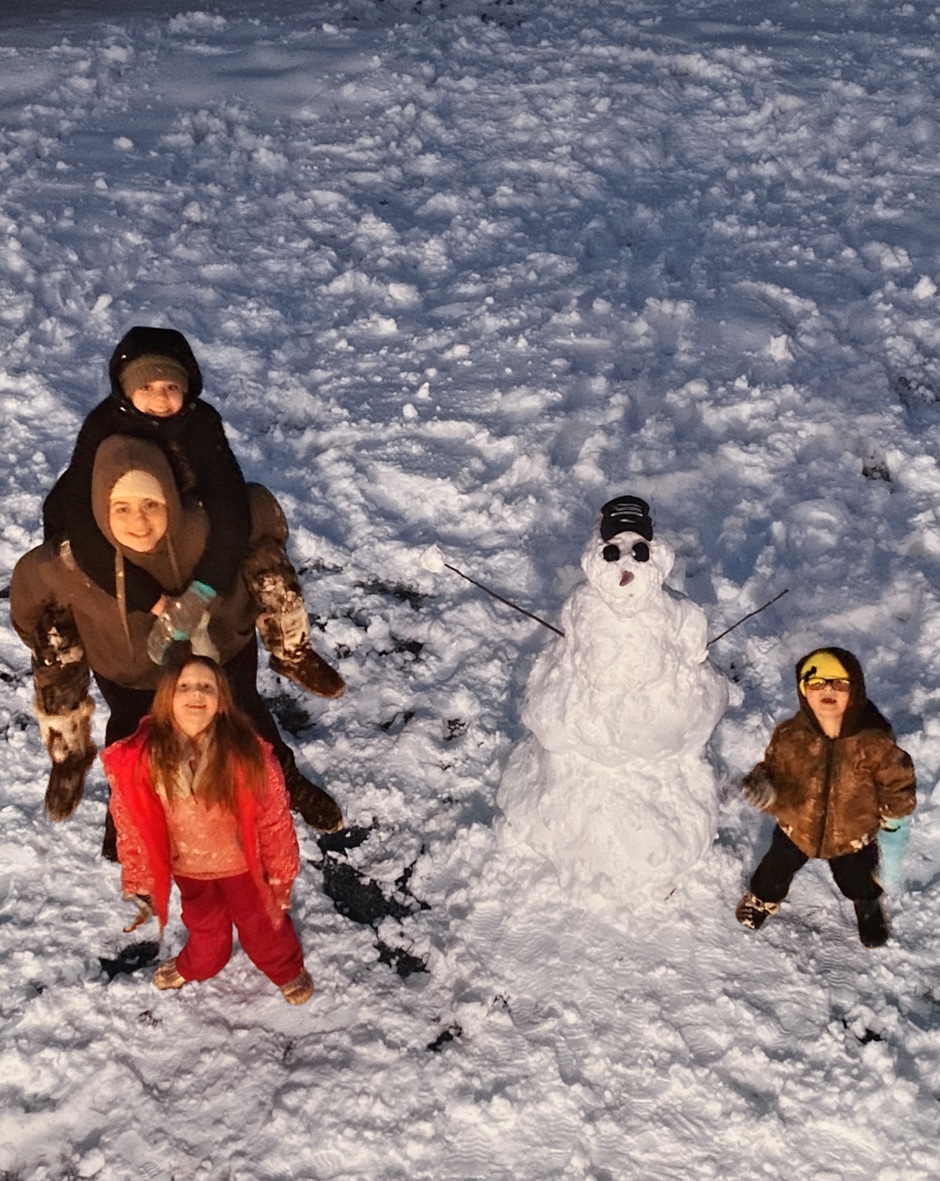 Abernathy kids building a snowman