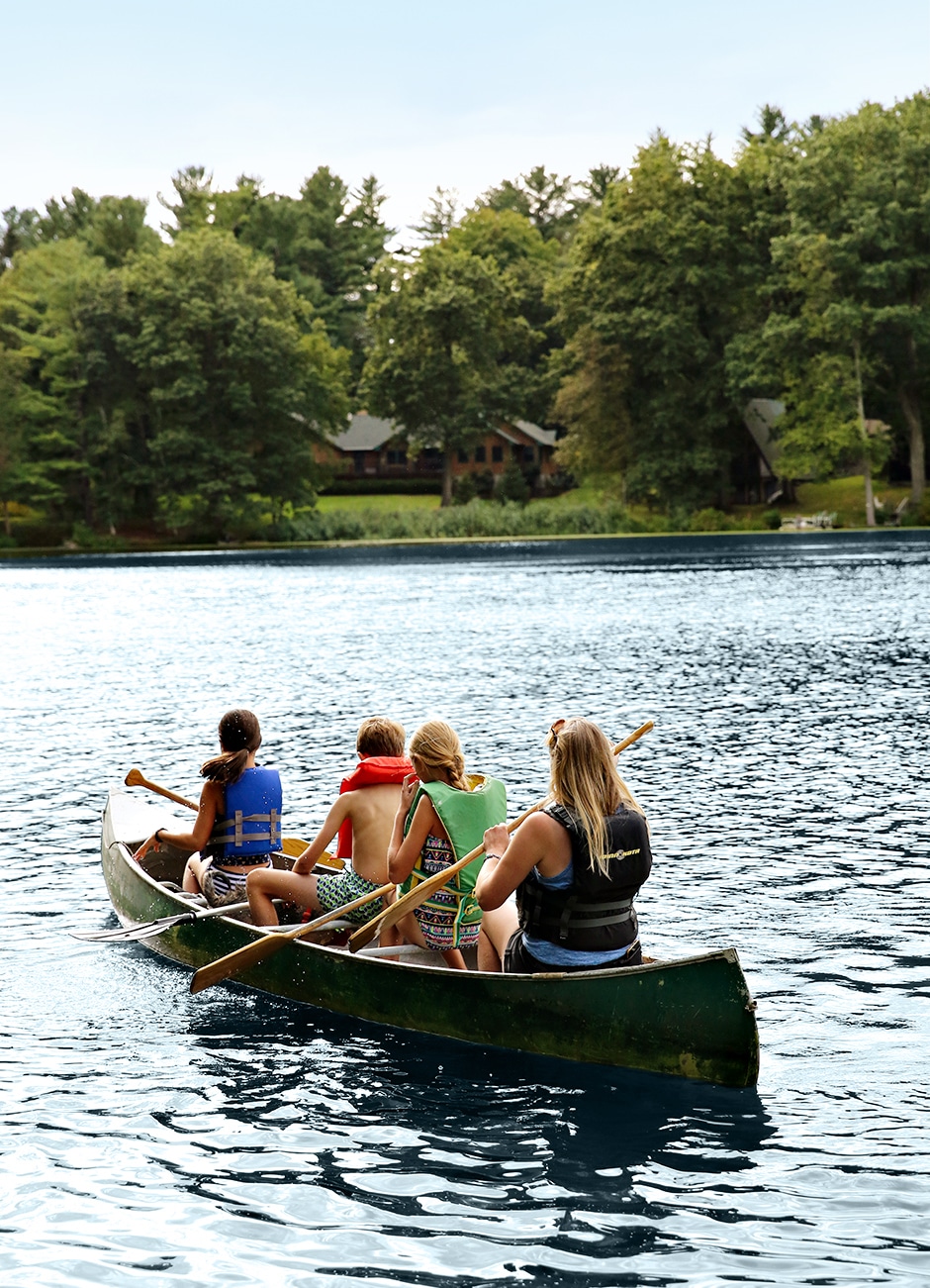 kids canoeing on lake
