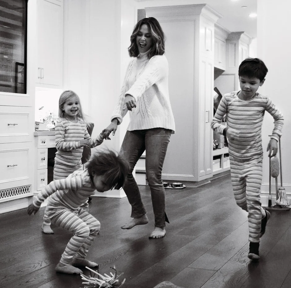 kids and mom dancing in matching pajamas