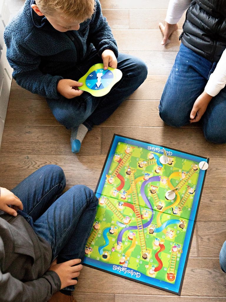 kids playing chutes and ladders
