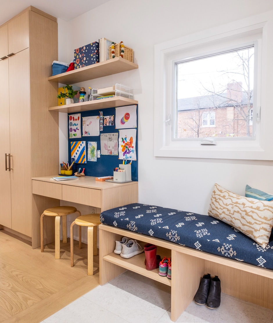 window seat with custom built cabinet in kid's room