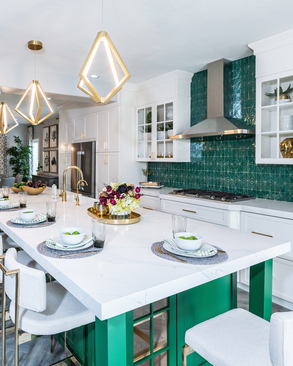 kitchen with green backsplash and island