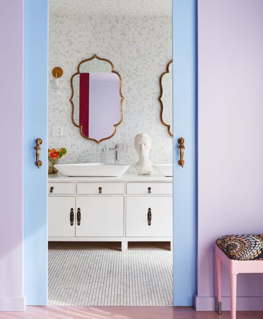 lavender and blue entry to white elegant bathroom