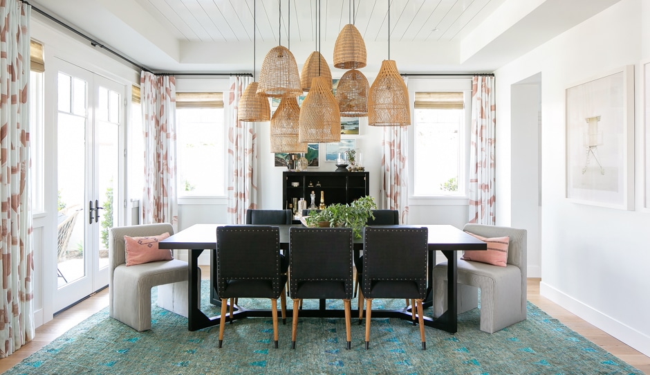 modern california dining room with wicker pendant lights
