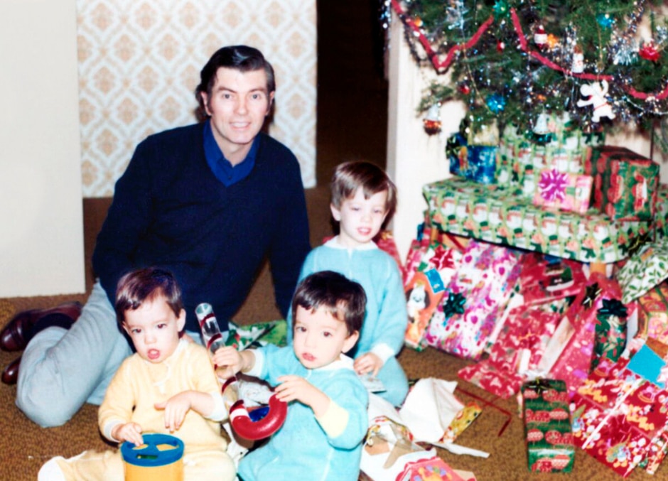 dad and scott sons on christmas morning