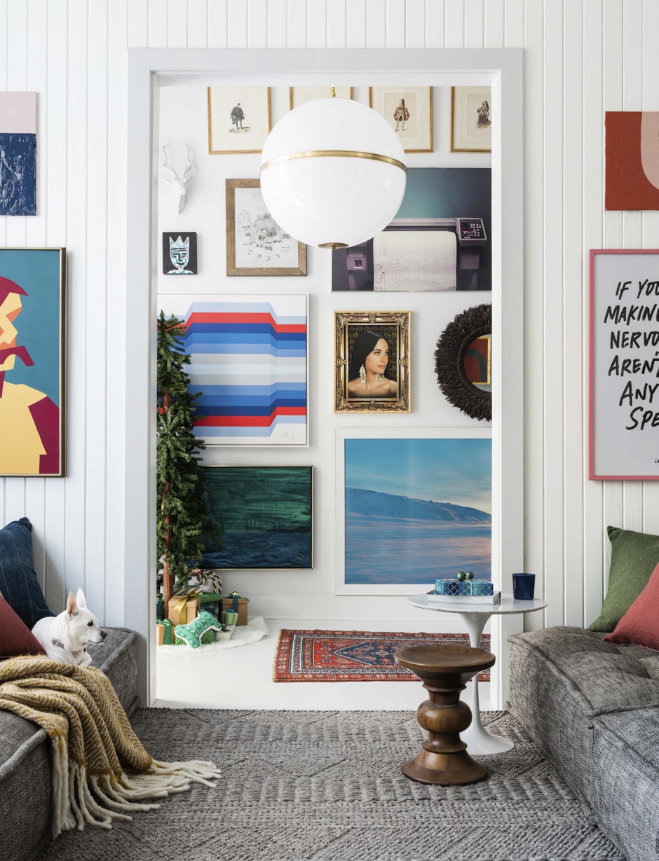 sitting room with gallery wall of colorful artwork