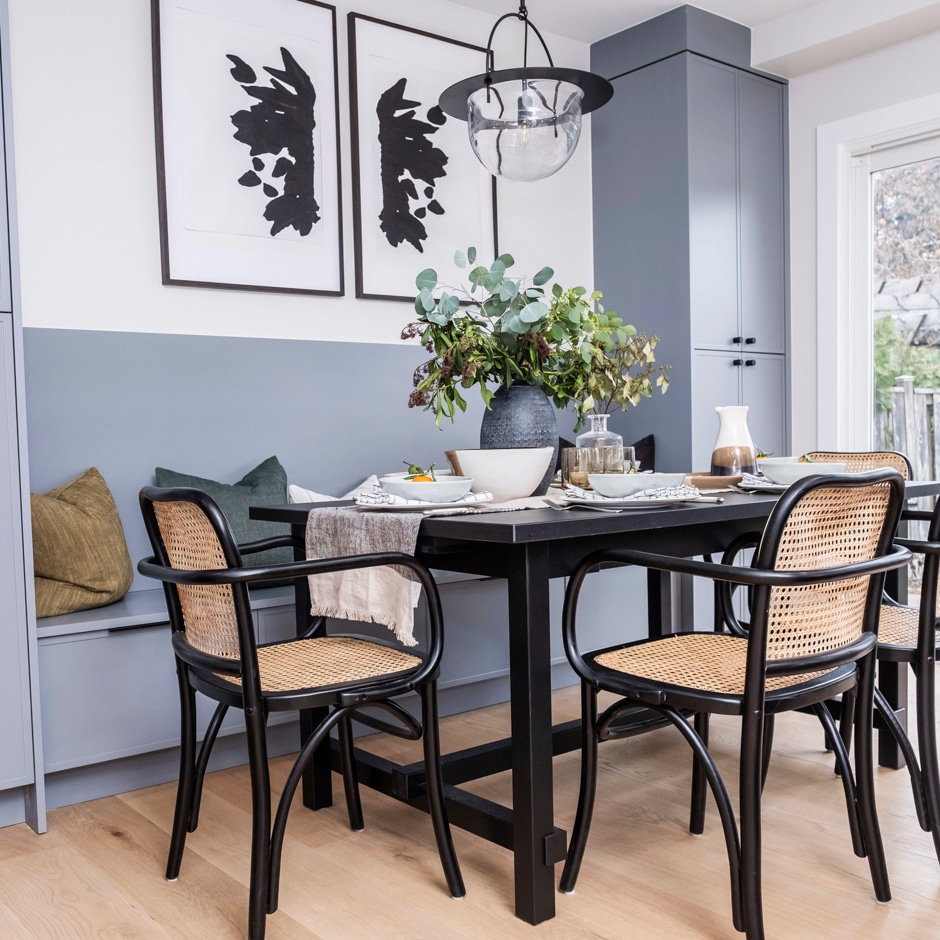 slate blue wall banquette with black chairs