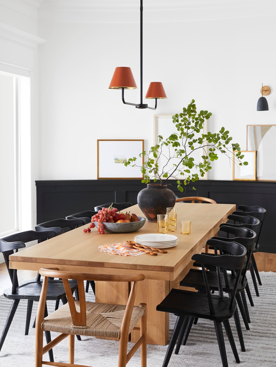 spacious dining room table with black chairs
