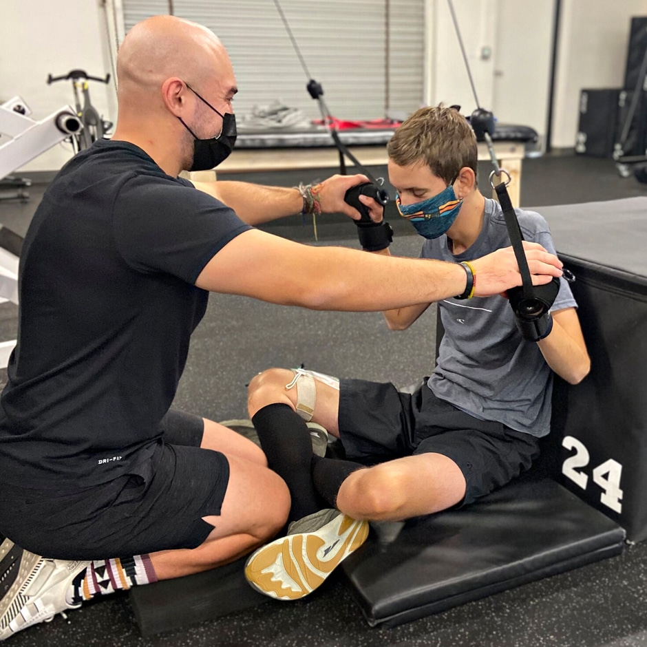 coach working with boy at victoria's victory foundation