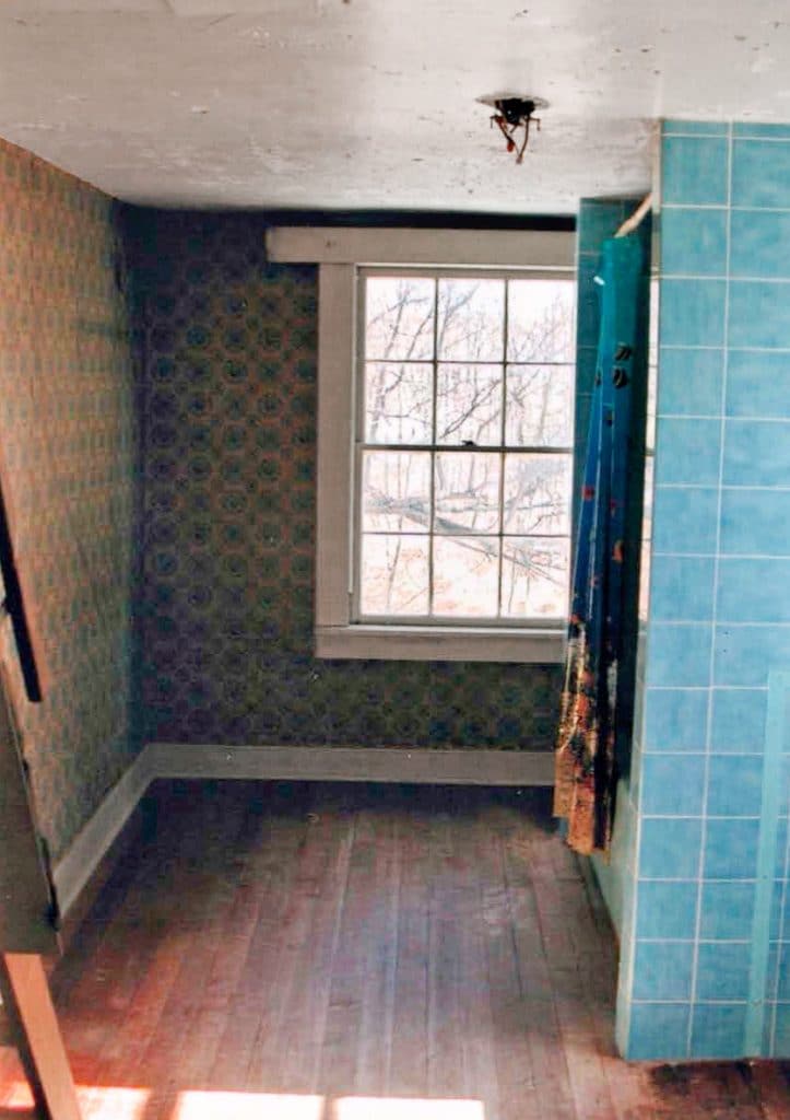 wallpapered bathroom before renovation