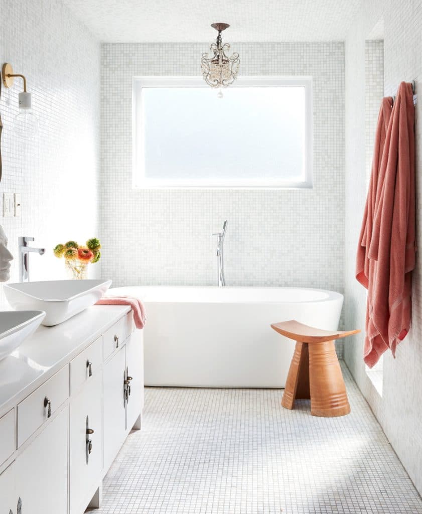 white elegant bathroom with coral accents