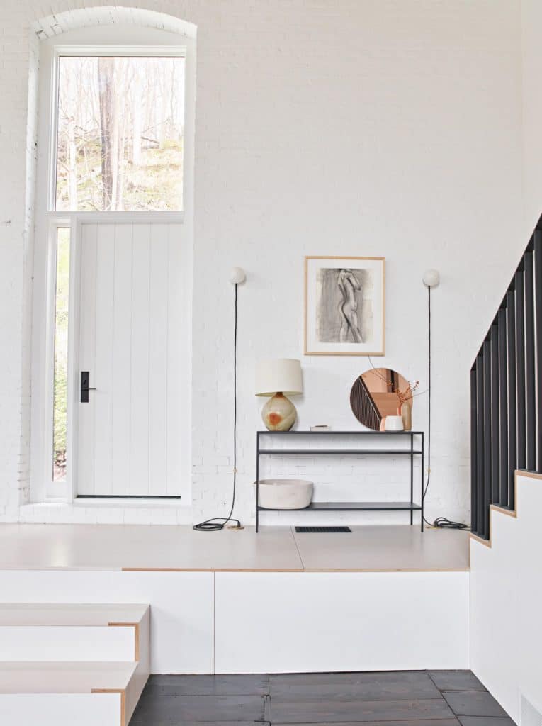 white entryway with staircase