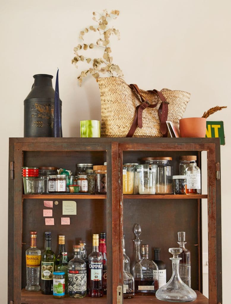 metal cabinet with liquor and spices