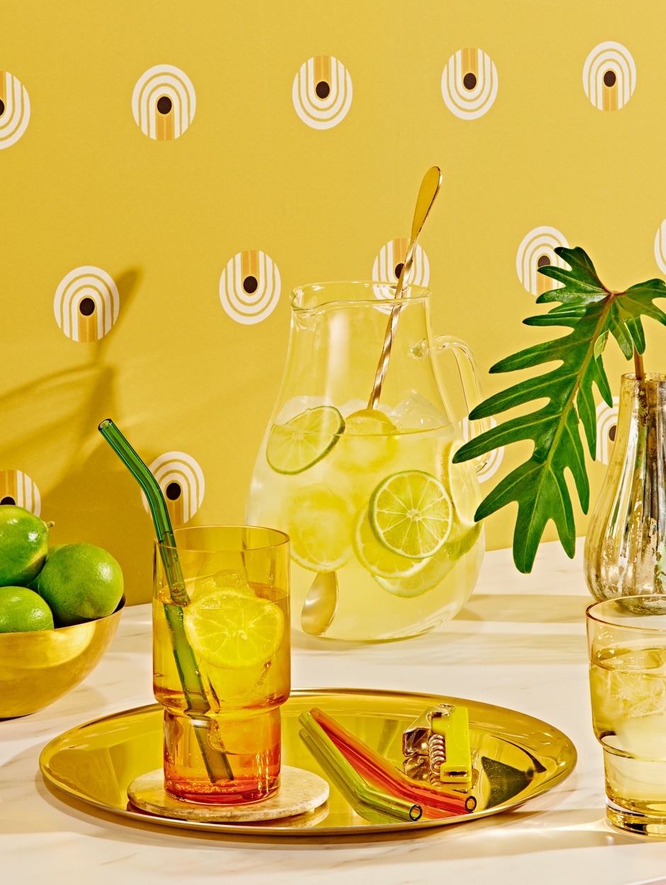 lemonade on a tray in front of a yellow patterned wall