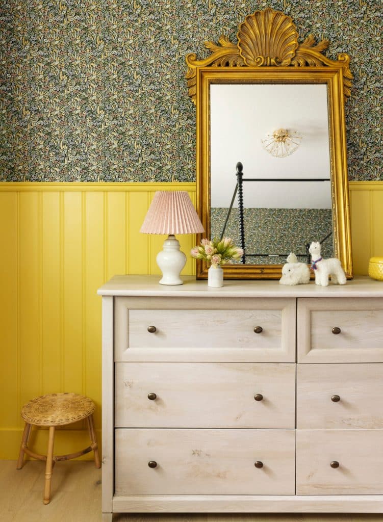 wallpaper and yellow walled bedroom