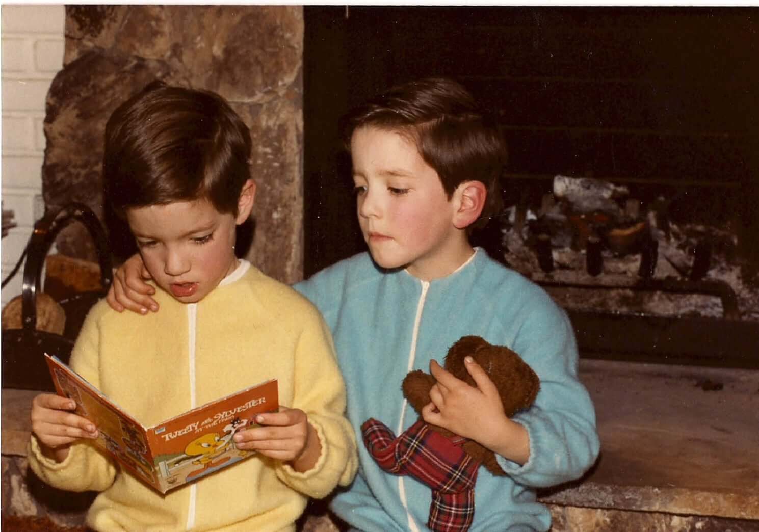 Young Drew and Jonathan read a picture book together