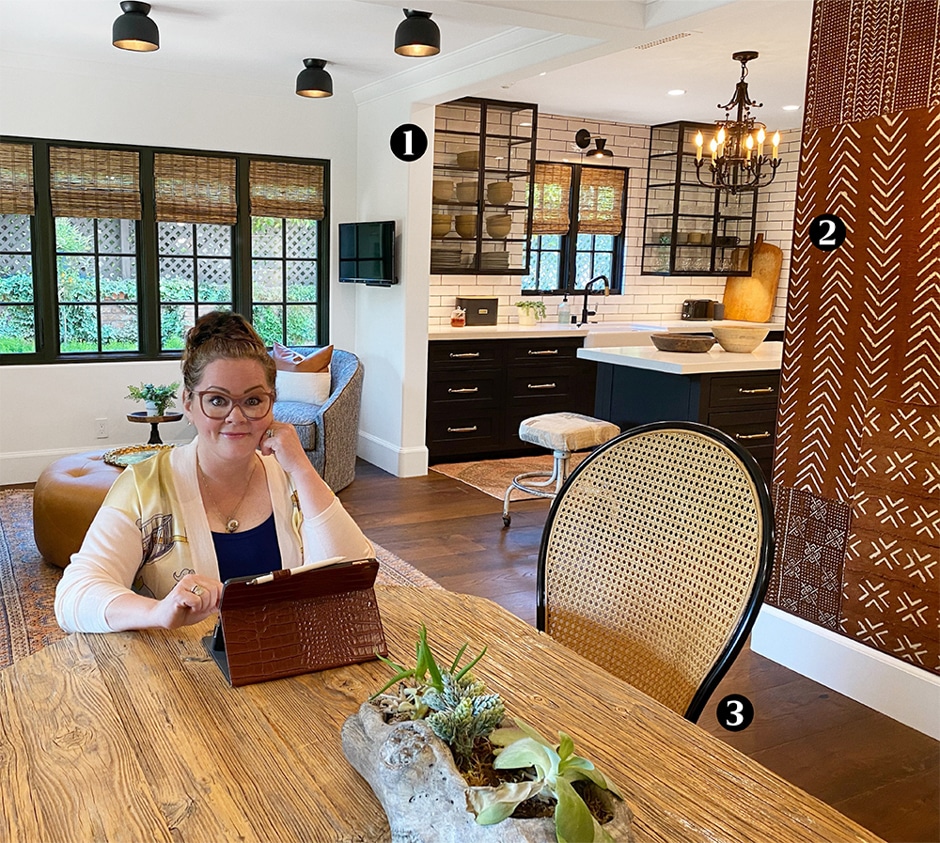 melissa mccarthy sitting at table in home