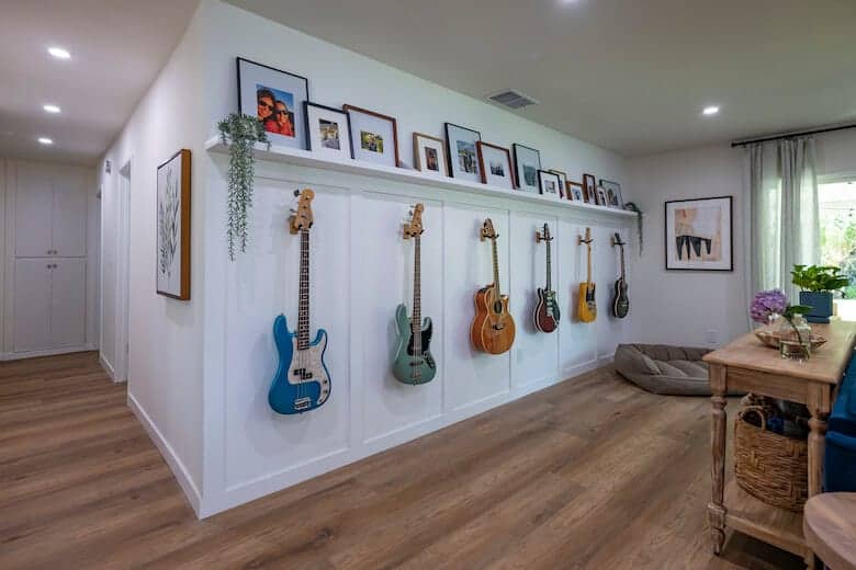 guitars hung on white wall for ginger and alex Property Brothers Forever Home renovation