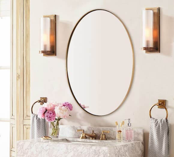Gold oval wall mirror